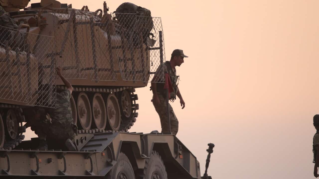 Turkish soldiers with armored vehicles and tanks during a military operation in Kurdish areas of northern Syria