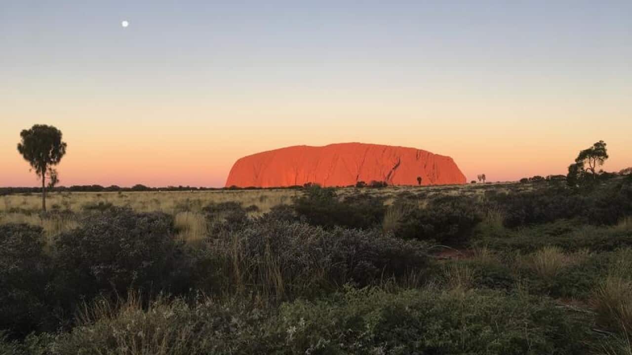 A helicopter crash near Uluru has left two of four passengers critical