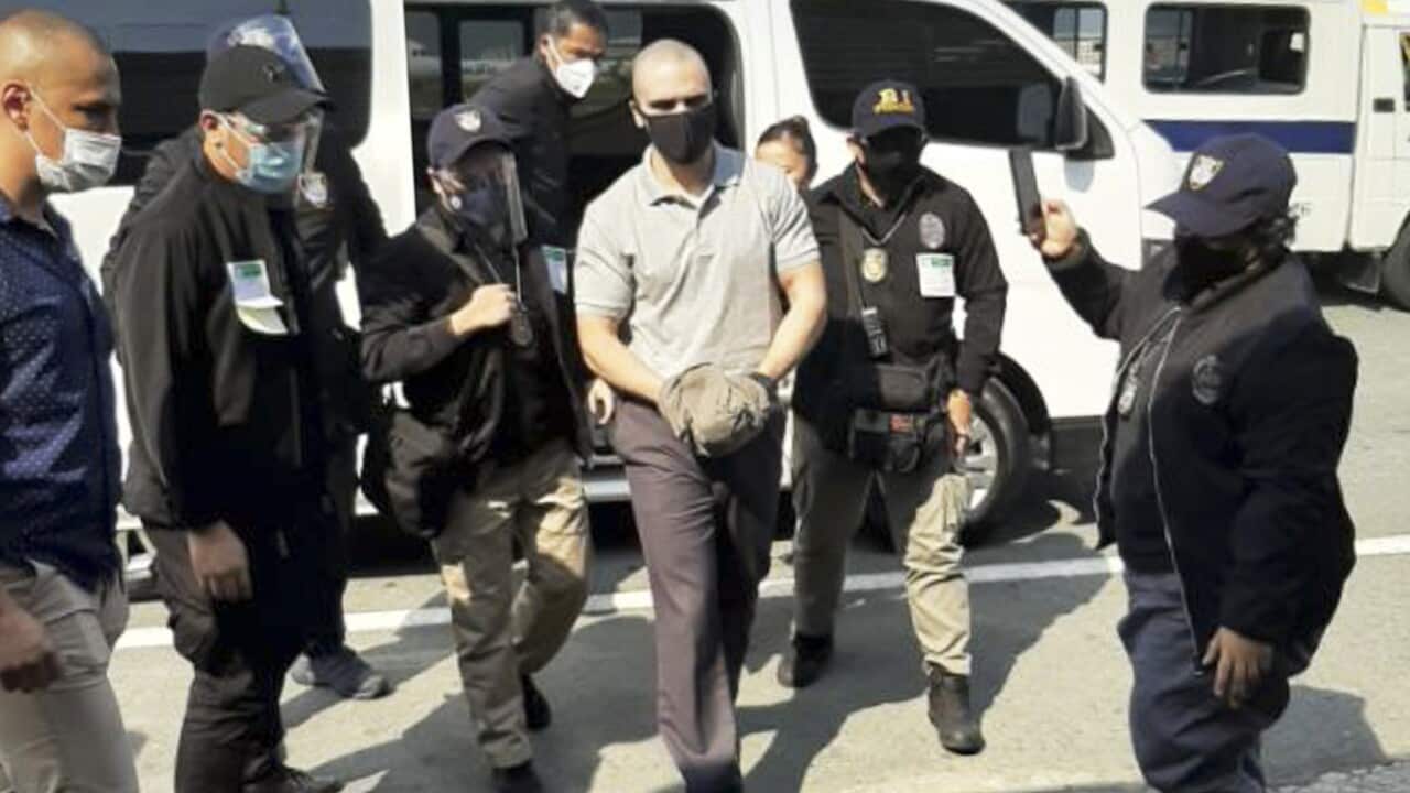 Joseph Scott Pemberton is escorted to the airport before boarding a US military plane in Manila on 13 September.