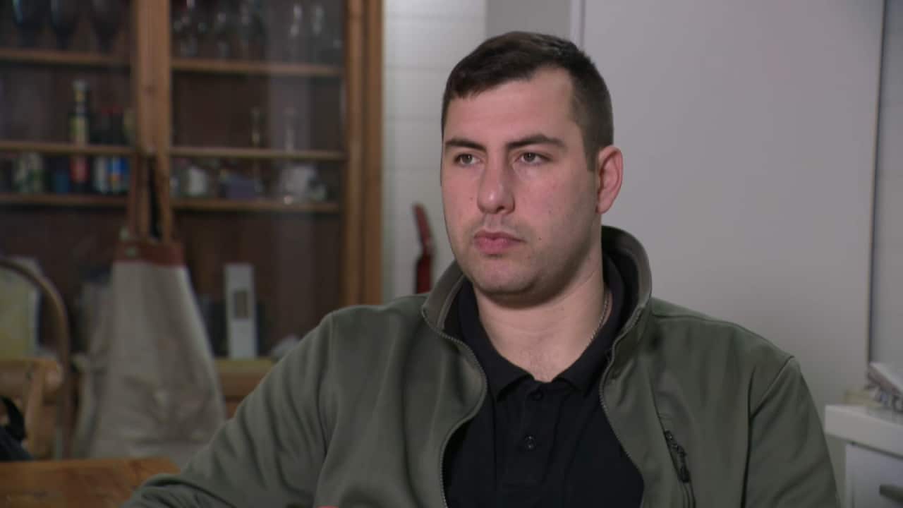 A man sitting for an interview