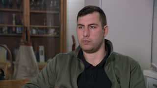 A man sitting for an interview