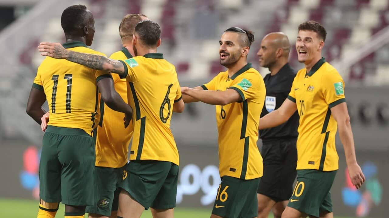 Awer Mabil celebrates a goal with his Socceroos teammates