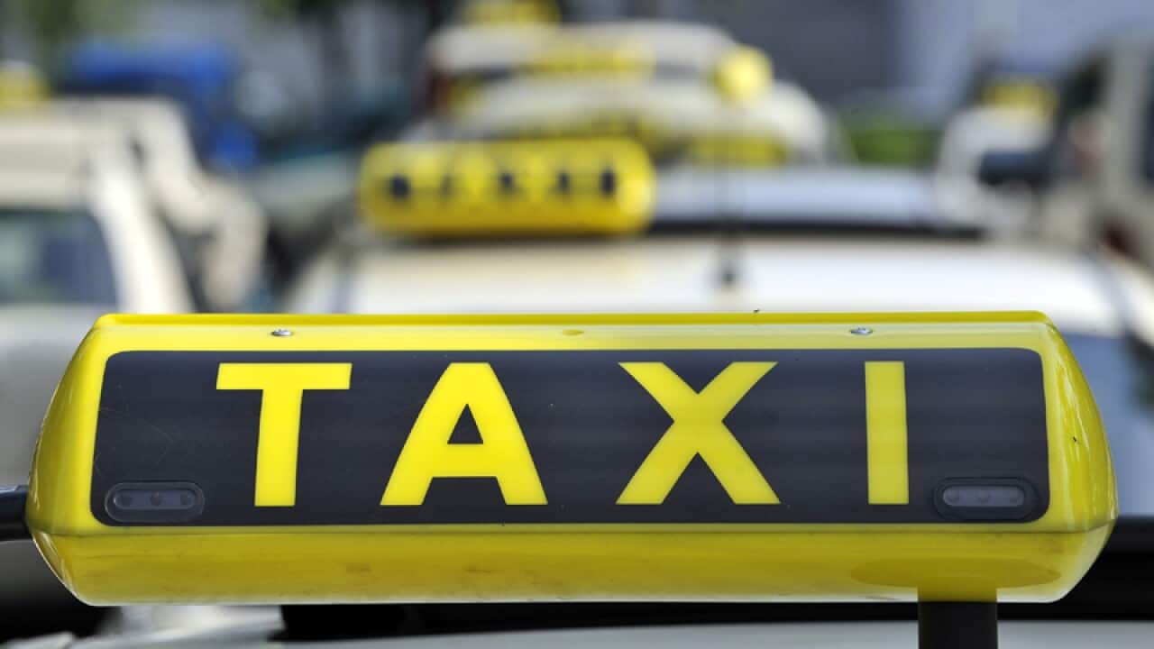 taxi cabs are seen at Tegel Airport in Berlin