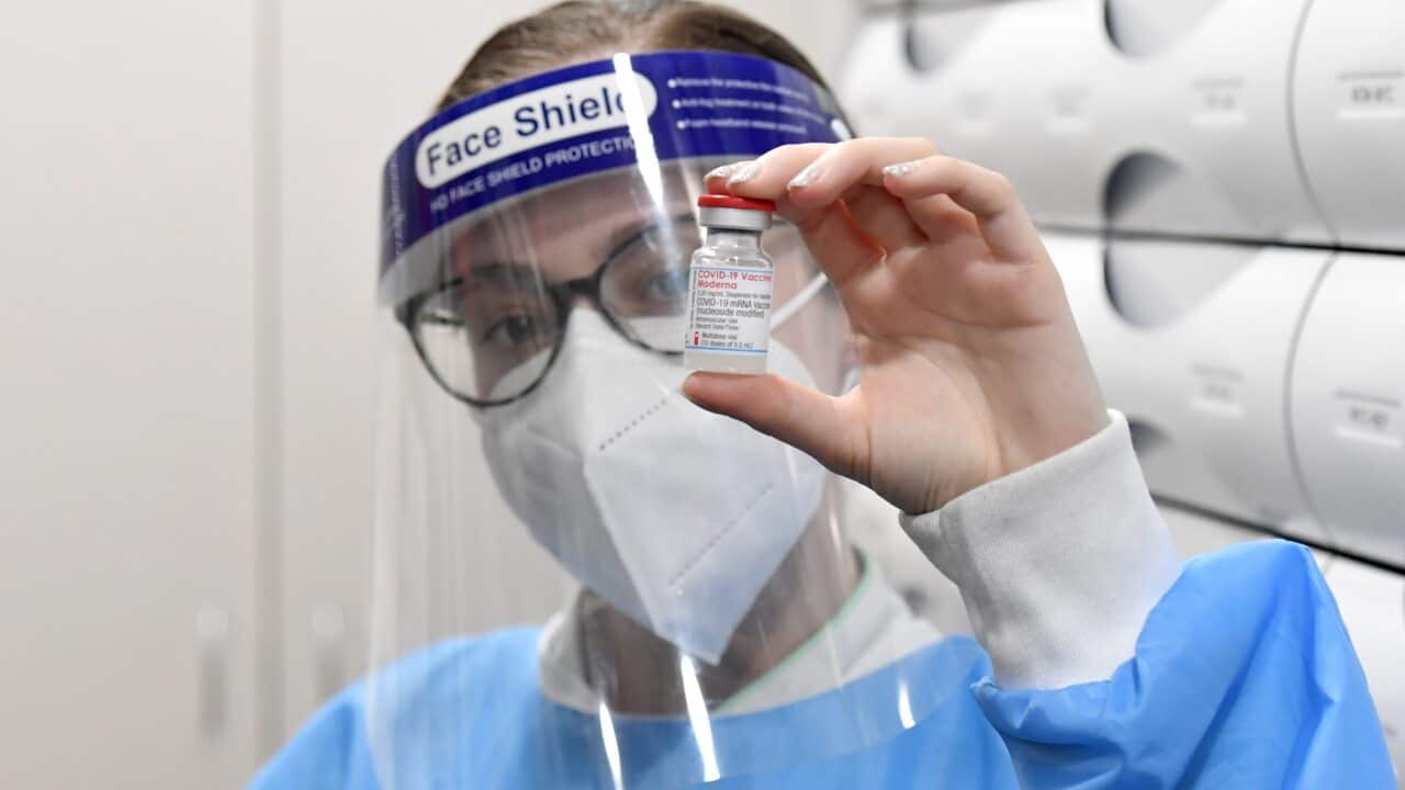 Pharmacist Chloe Langfield holds a vial of the Moderna COVID-19 vaccine at Cooleman Court Pharmacy in Canberra, Thursday, September 23, 2021. (AAP Image/Mick Tsikas) NO ARCHIVING