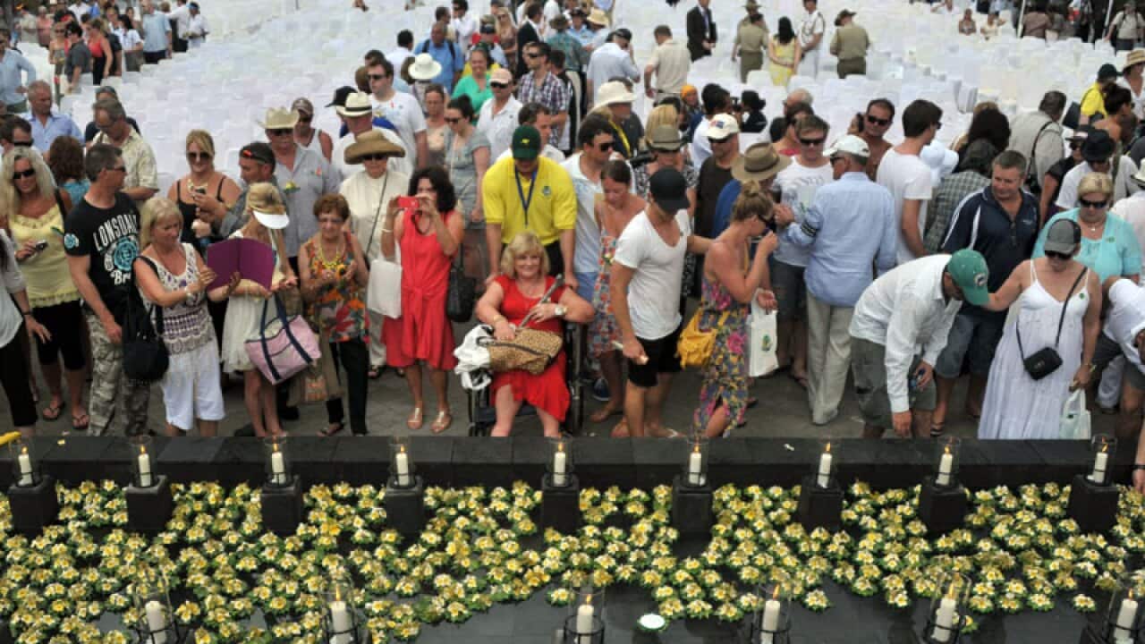 Survivors and relatives of the victims of the 2002 Bali bombings mourn during a ceremony held in Jimbaran, Bali. (Getty Images)
