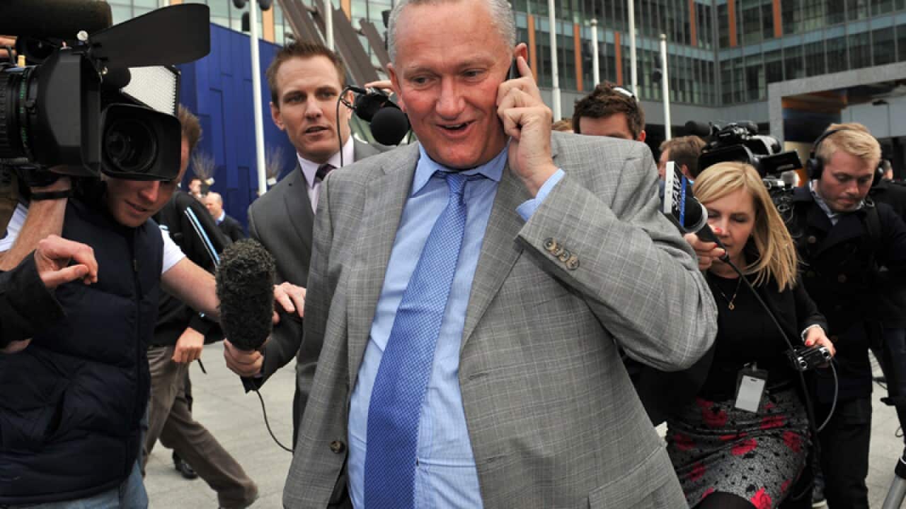 Sports scientist Stephen Dank (C) leaves the Federal Court