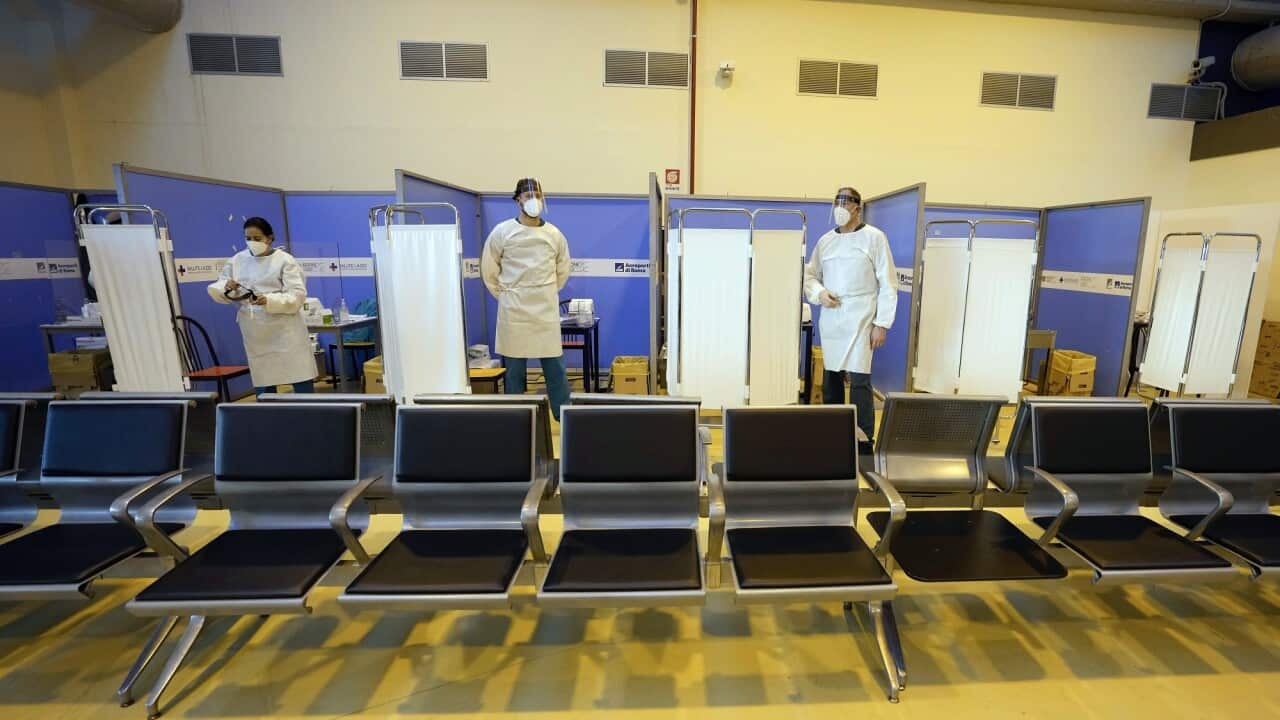 Medical staff at a COVID-19 testing area at Rome's Leonardo da Vinci international airport.