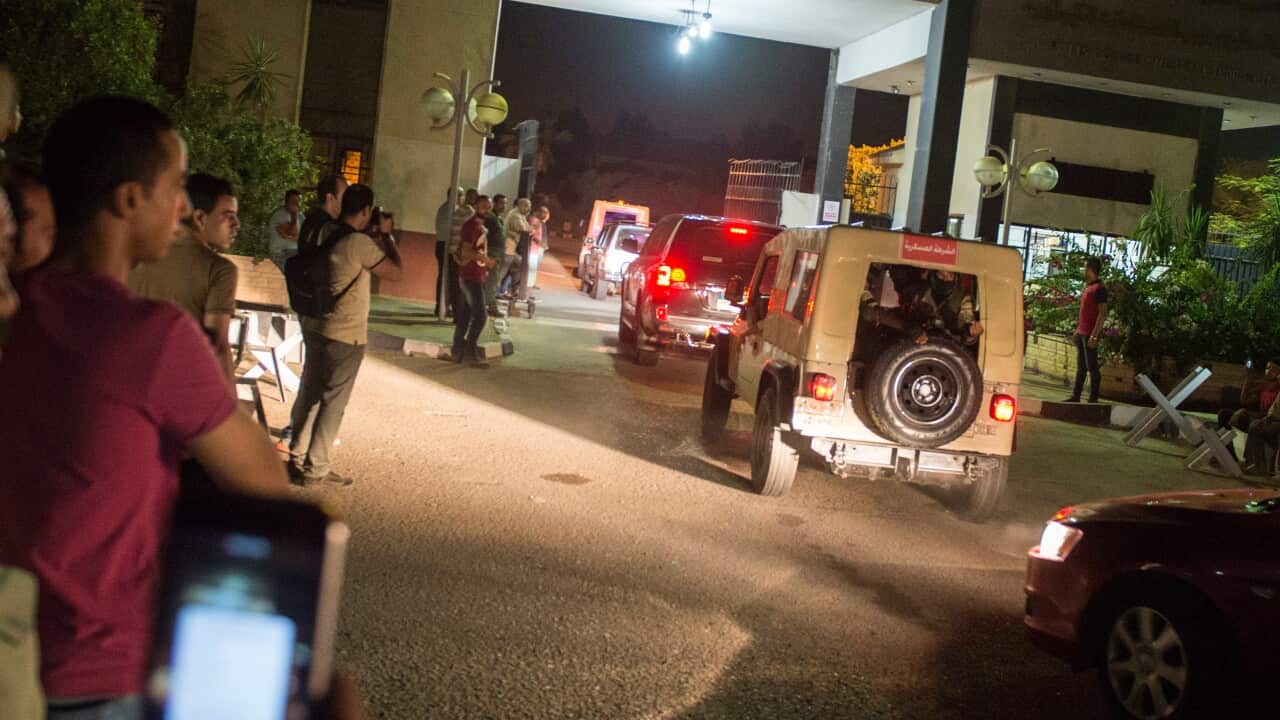 Emergency personnel at the scene after a large explosion at a military owned petrochemical plant near Cairo International Airport, Cairo, Egypt, early 13 July 2018. Twelve people were injured in the blast in Joseph Tito Street, Cairo's Heliopolis district
