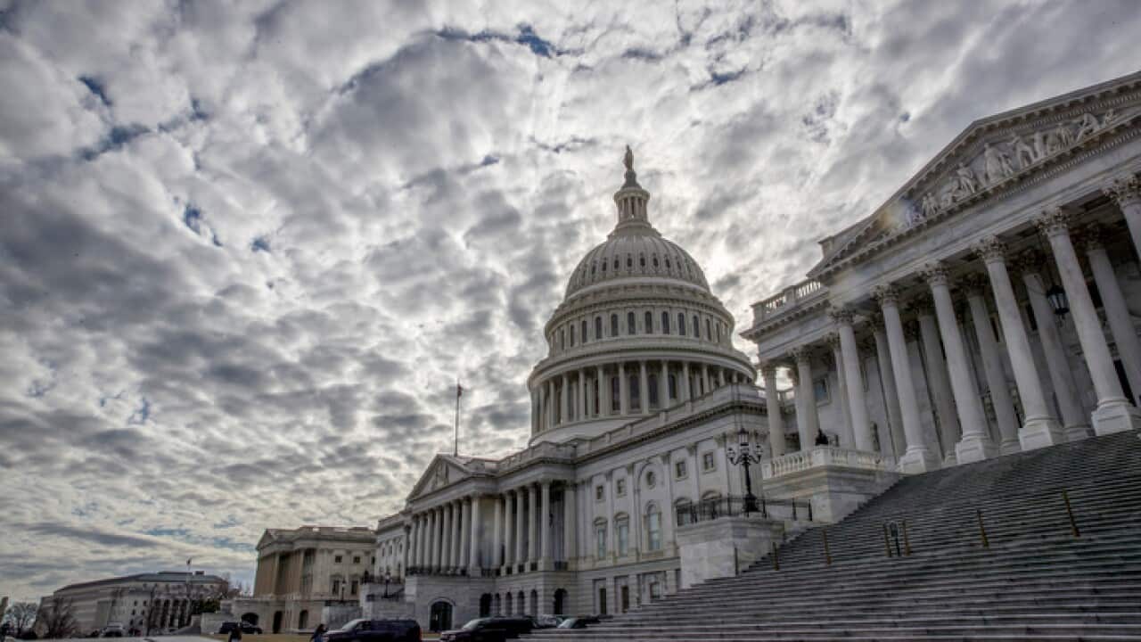 The Capitol is seen under cloudy skies on Day 2 of the federal shutdown, in Washington, Sunday, Jan. 21, 2018. (AP Photo/J. Scott Applewhite)