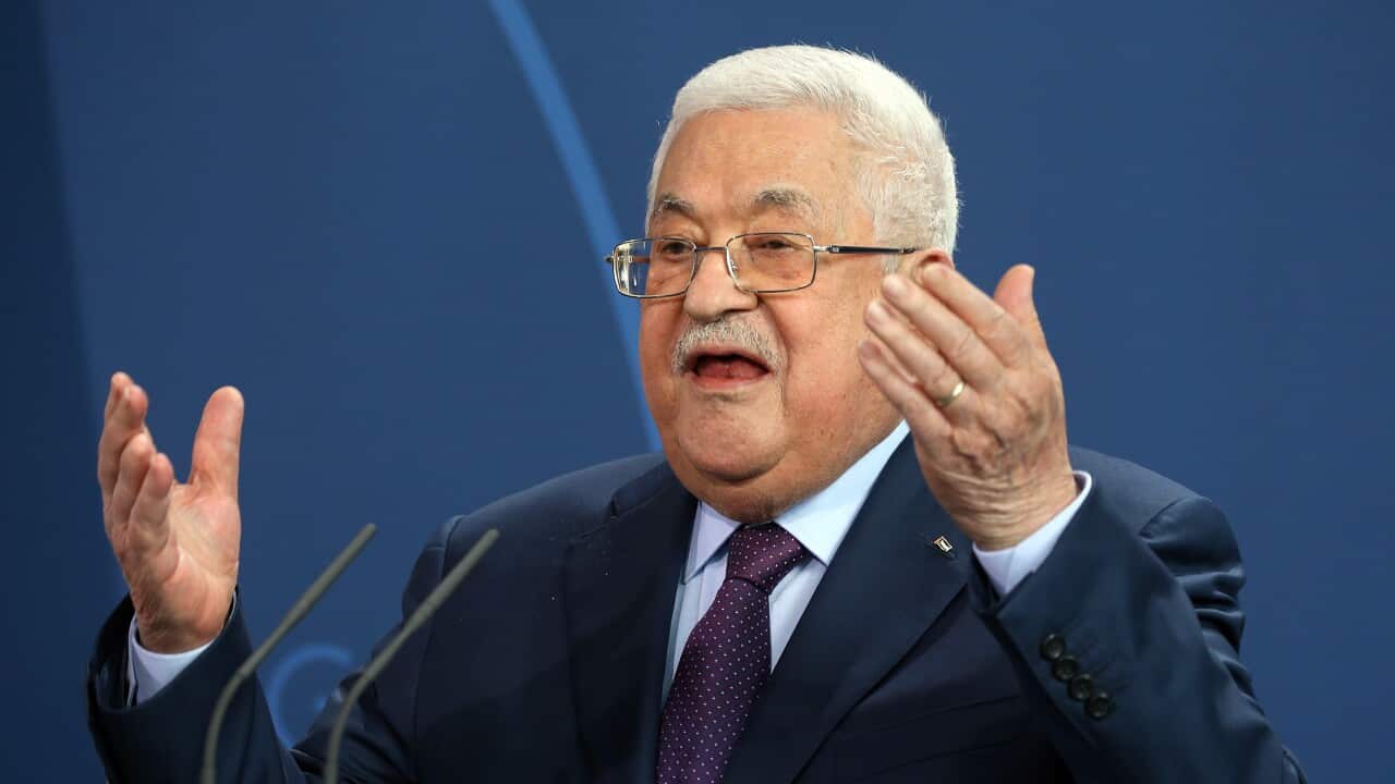 An old Palestinian man in a suit