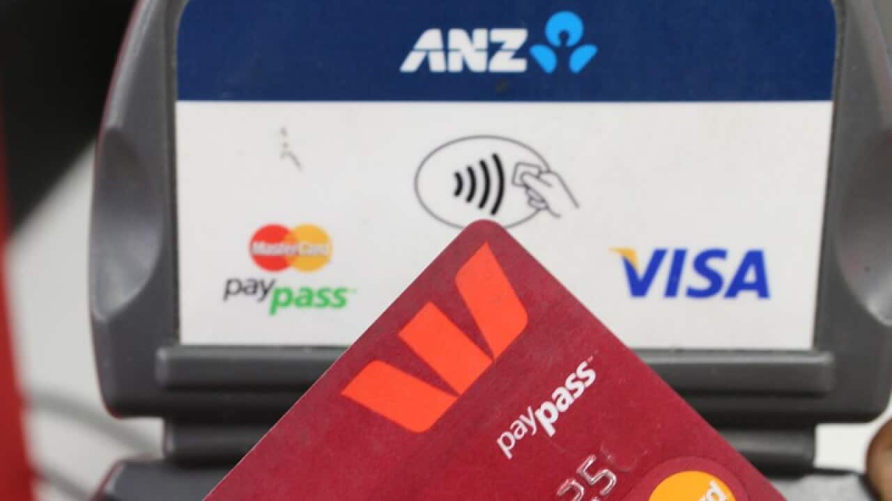 A person uses a credit card