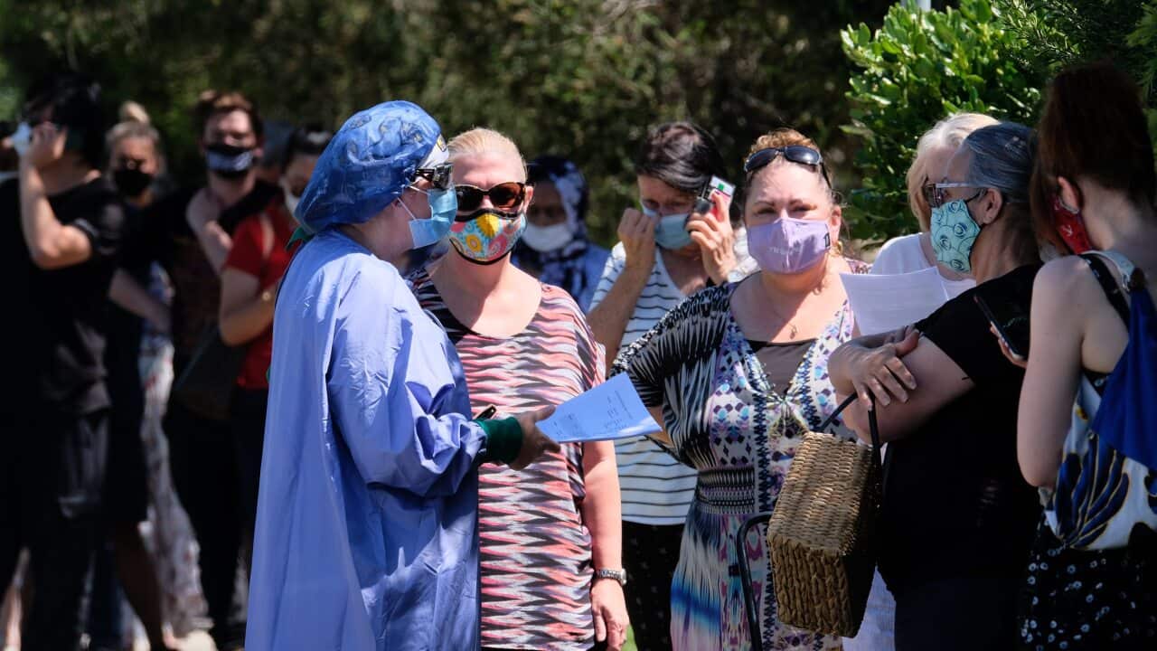 A file photo of people lining up to get tested at the Sunbury Respiratory Clinic in Melbourne.