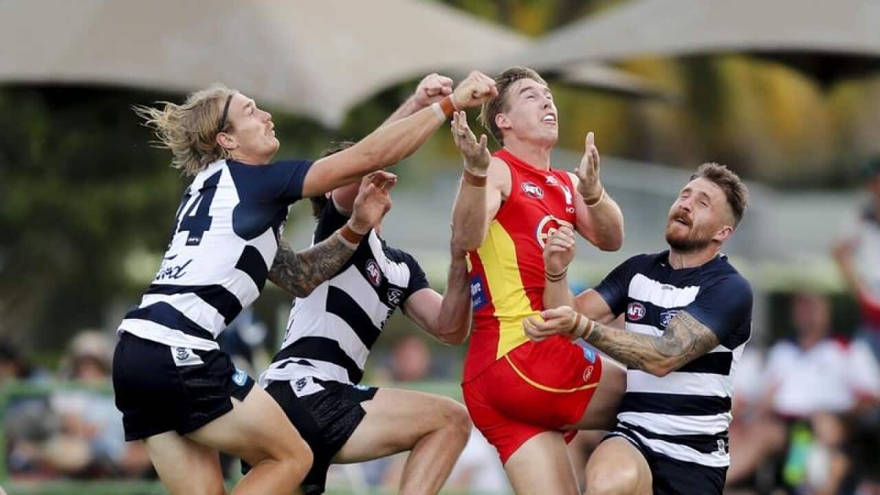 Gold Coast Suns' Tom J. Lynch takes a mark against the Geelong Cats.
