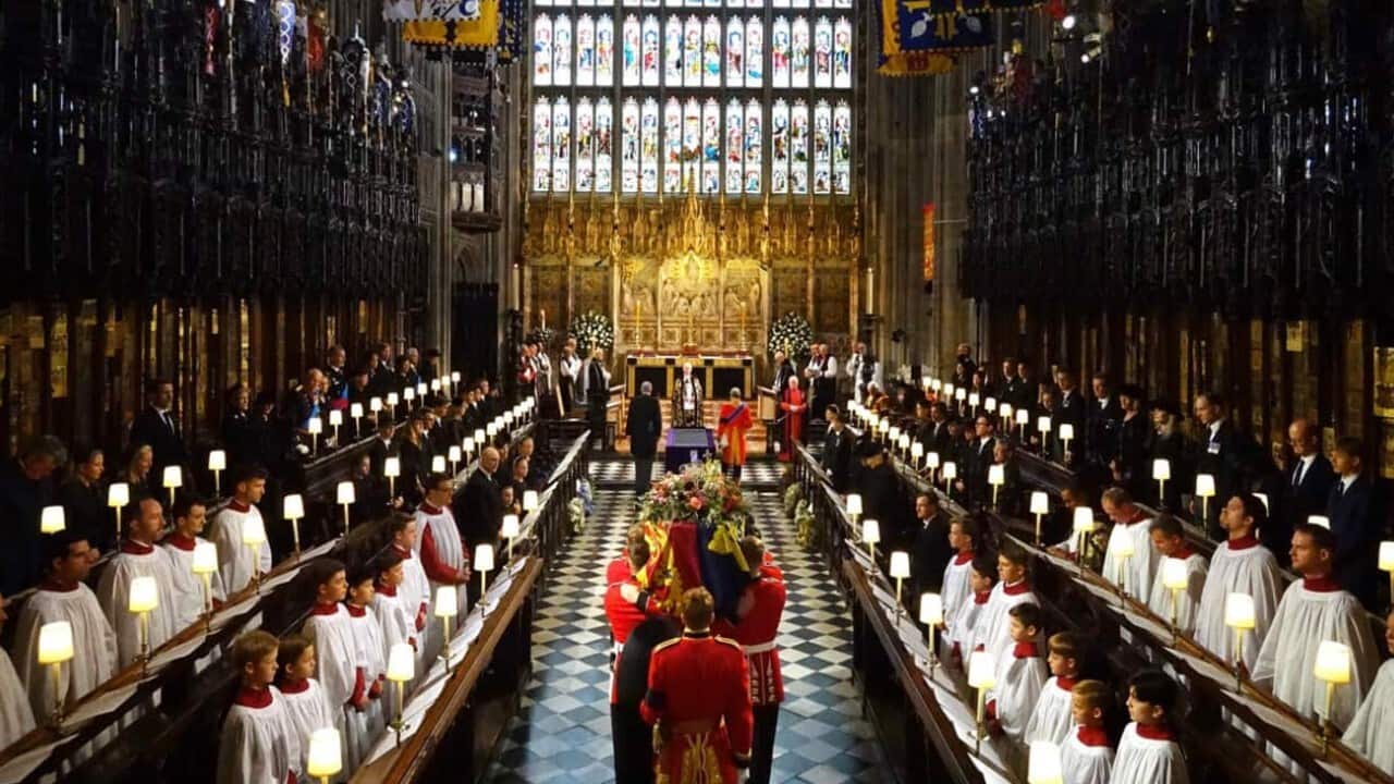 The coffin of Queen Elizabeth II is carried by pallbearers from the Queen's Company.jpg