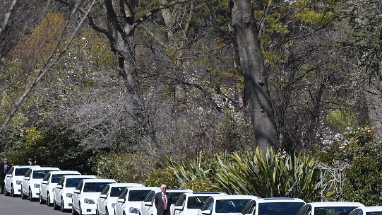 Comcars are parked outside Government House during a swearing-in ceremony at Government House in Canberra, Monday, Sept. 21, 2015 (AAP)