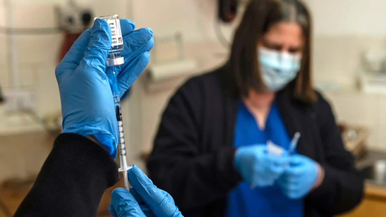 Medics in the Cypriot village of Evrychou in the Nicosia district, prepare to inoculate an inhabitant
