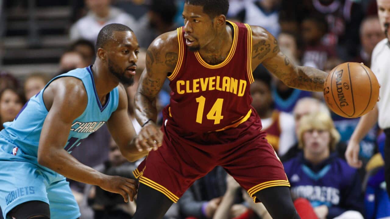 Cleveland Cavaliers guard DeAndre Liggins, right