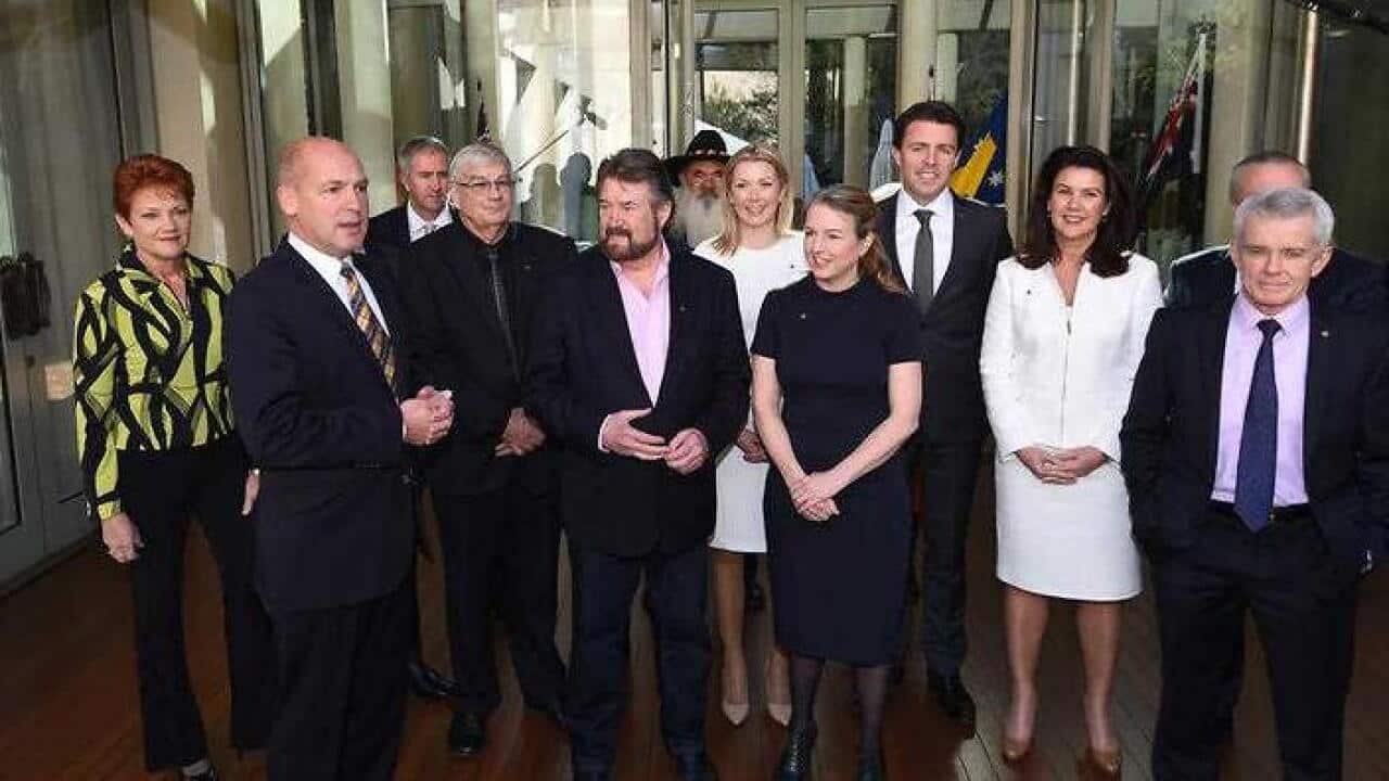 Senate President Stephen Parry (second left) with 14 new senators before an induction for new senators at Parliament House in Canberra. (AAP)