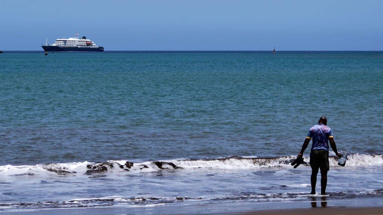 The MV Hondius cruise ship is anchored at a port in Praia, Cape Verde