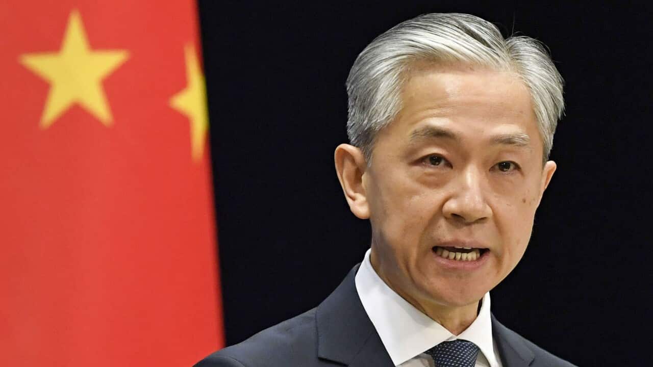 Chinese Foreign Ministry spokesman Wang Wenbin attends a press conference in Beijing on Dec. 8, 2021. (Kyodo via AP Images) ==Kyodo