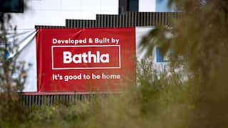 A red sign saying "Developed and built by Bathla".