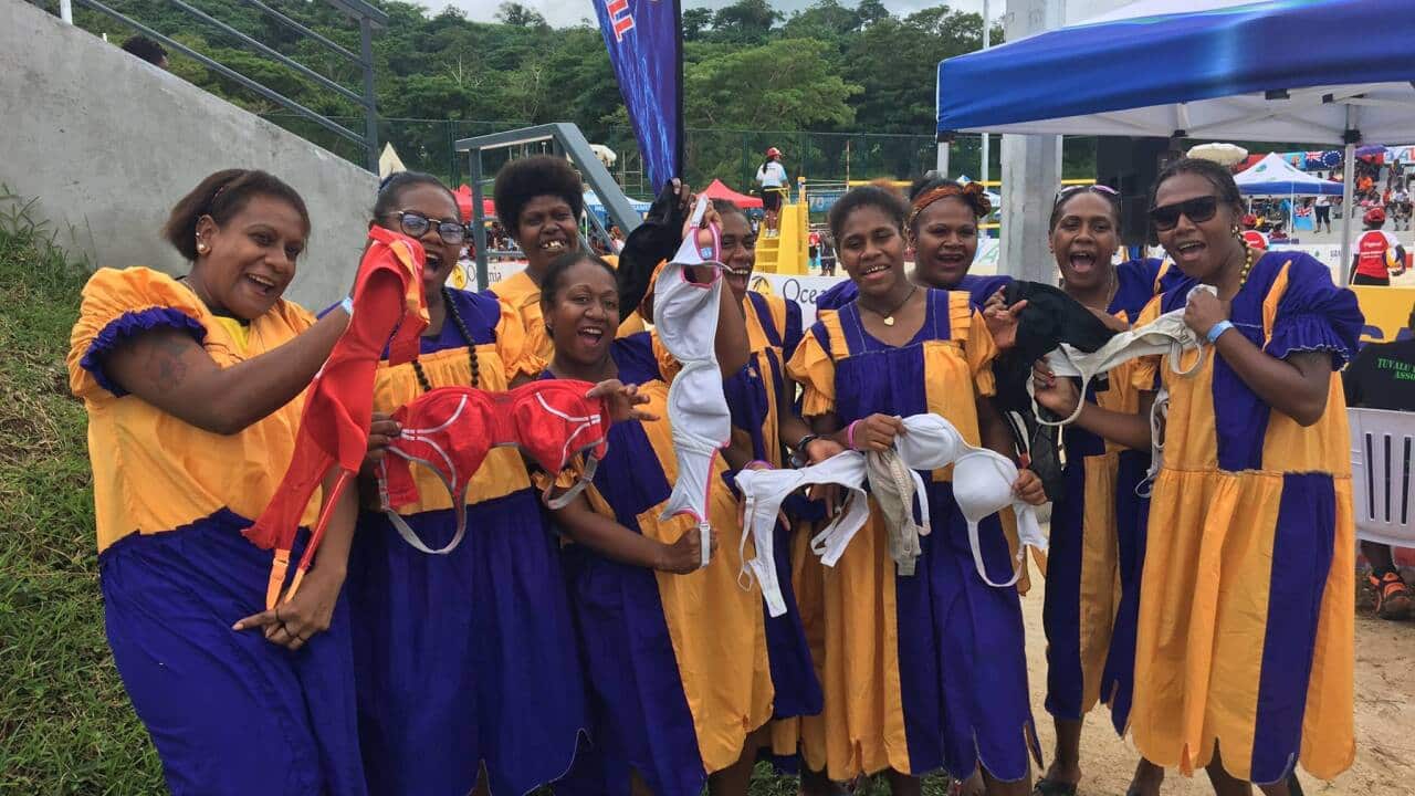 Women holding Uplift donations