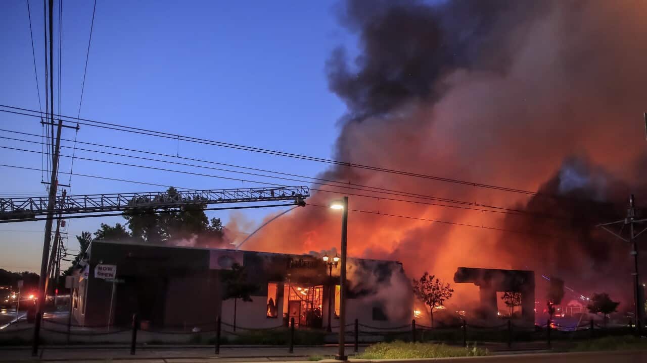 A business burns during protests over the Minneapolis, Minnesota arrest of George Floyd, who later died in police custody.