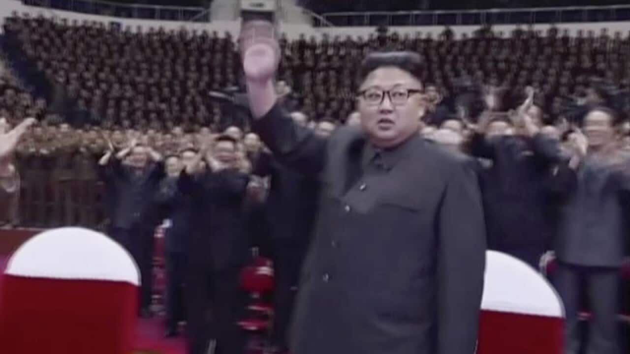 Kim Jong Un waves to the audience in Pyongyang