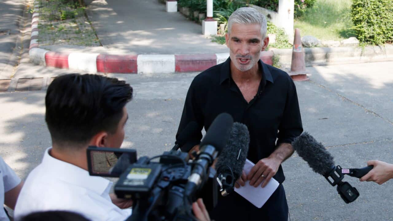 Former Australian soccer player Craig Foster talks to journalists after meets former member of Bahrain's soccer player Hakeem al-Araibi.
