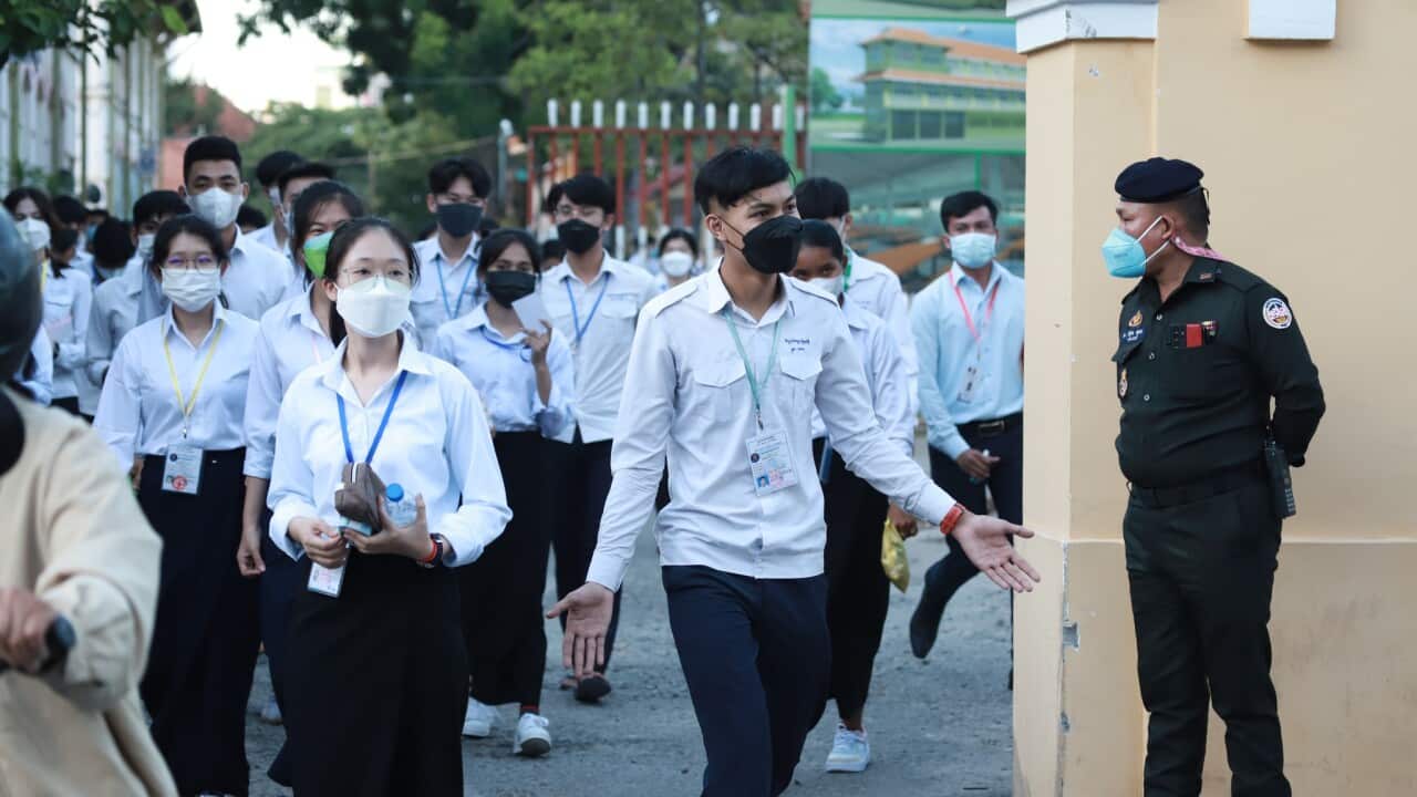 Students entering the exam center