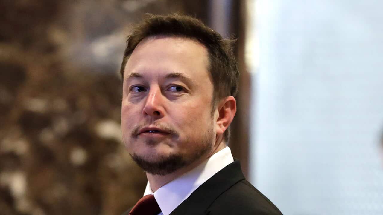 A man wearing a suit and tie.