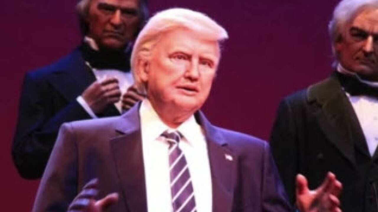 The robotic figure, on display at Disney's Hall of Presidents exhibit, stands on a stage alongside life-size models of Trump's predecessors.