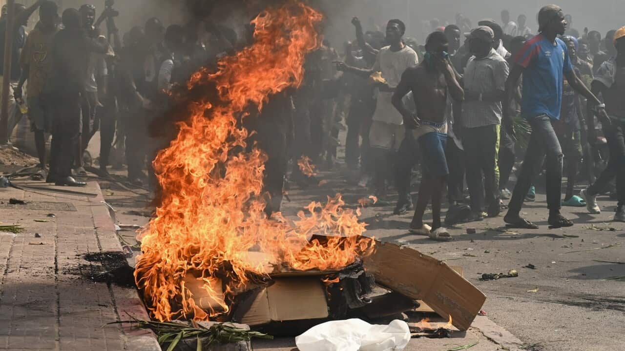 Protesters march against the escalating conflict in eastern DRC in Kinshasa