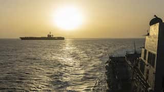 Two large military ships in the ocean