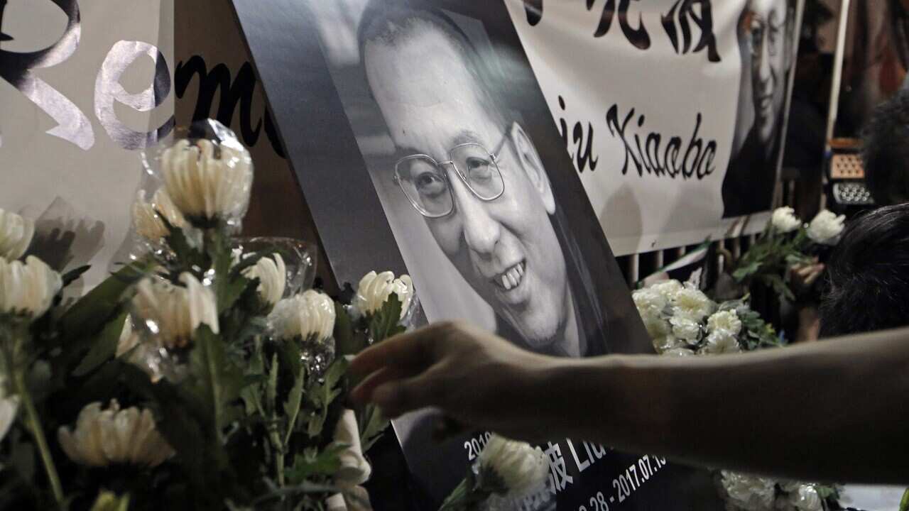 Tributes to jailed Chinese Nobel Peace laureate Liu Xiaobo during a demonstration outside the Chinese liaison office in Hong Kong.