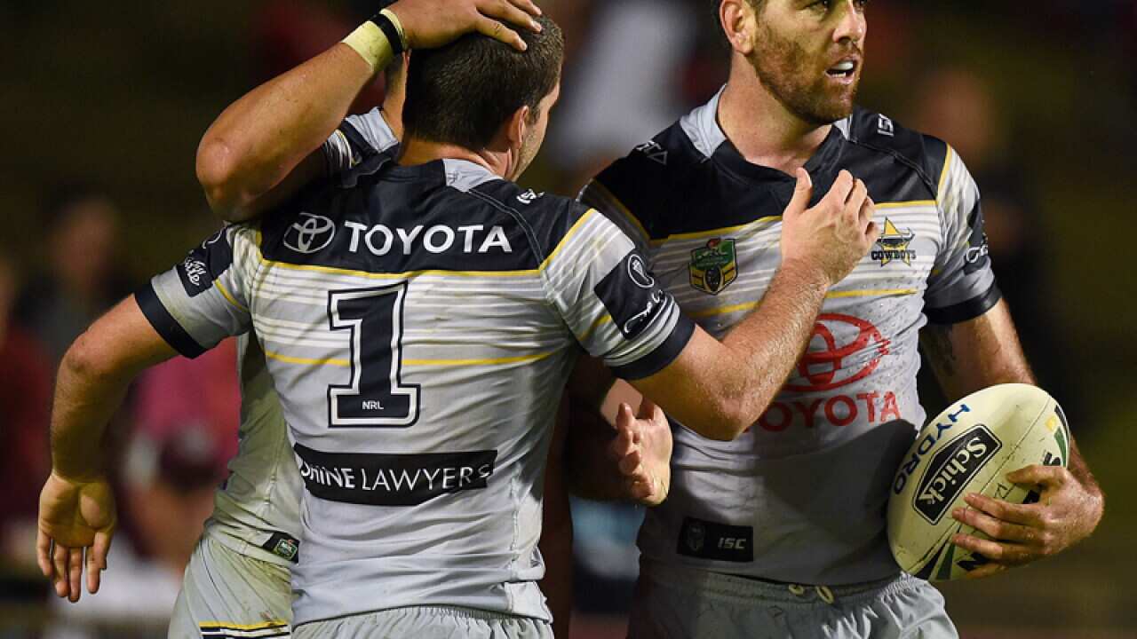 Kane Linnett of the Cowboys (R)celebrates with team mates