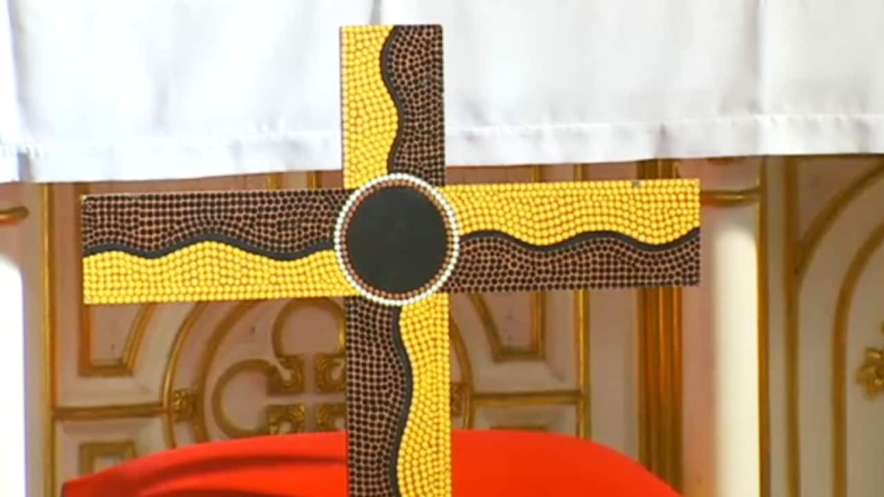 A cross covered in Aboriginal artwork at St John's Church in Glebe, Sydney.