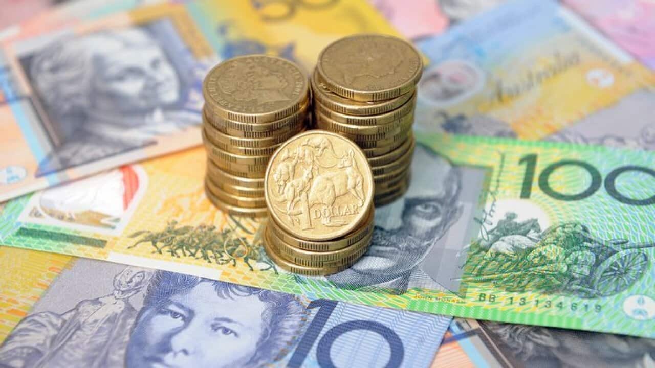 Australian dollars in Sydney, Friday, Jan. 15, 2016. (AAP Image/Joel Carrett) NO ARCHIVING