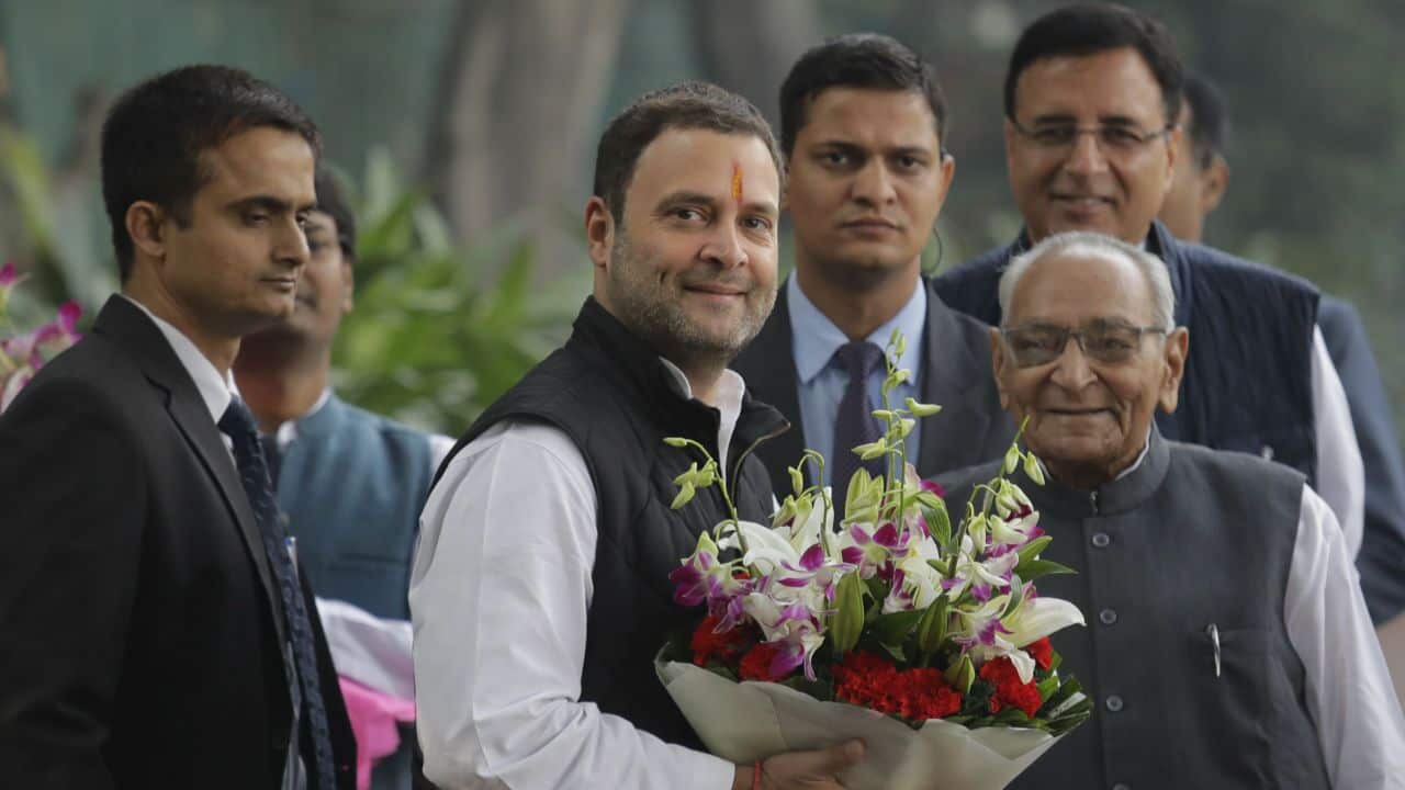 Senior Congress party leaders welcome Rahul Gandhi, second left, with flowers.