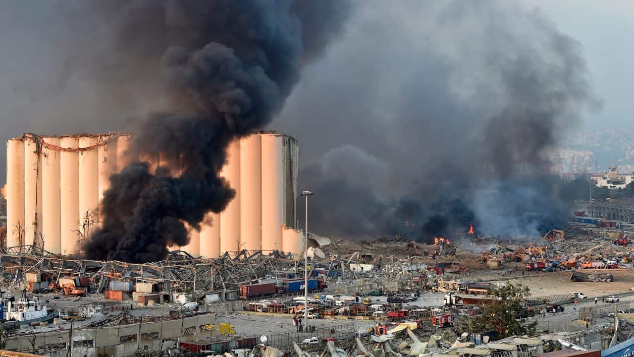 Smoke billows from harbor area with damage and debris after a large explosion rocked the harbor of Beirut, Lebanon, 4 August 2020.