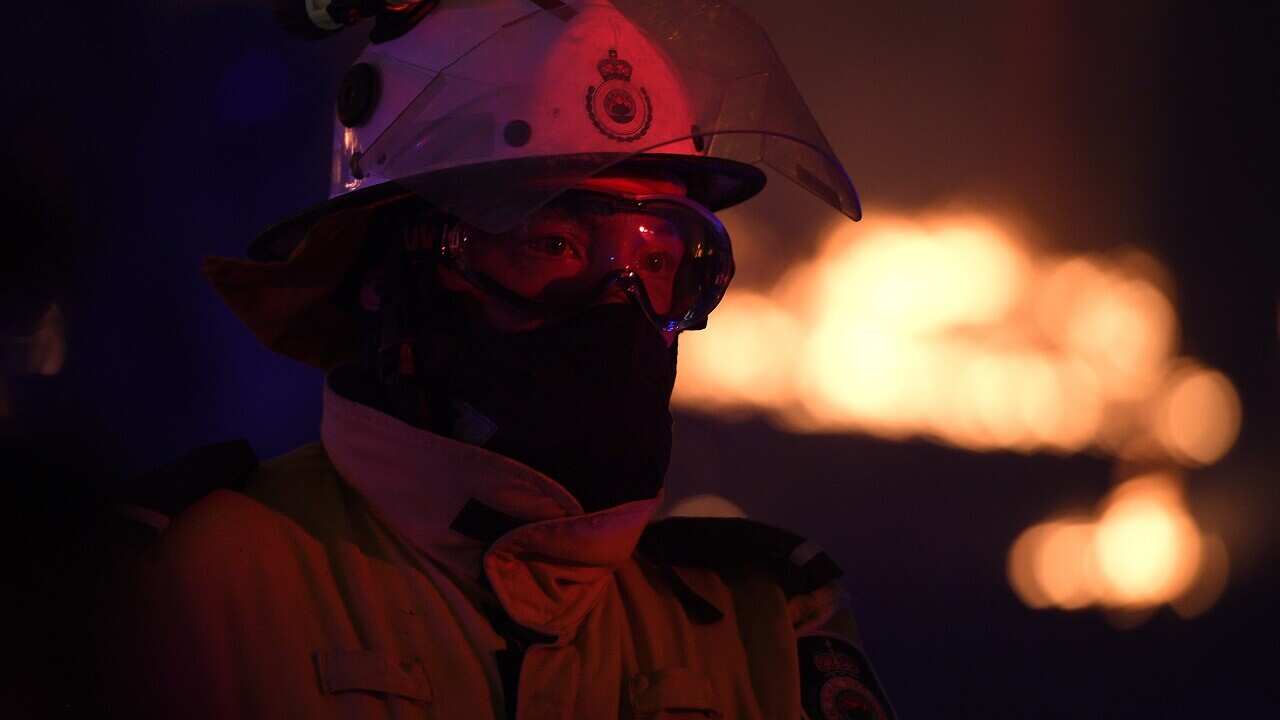 NSW Rural Fire Service crews protecting properties outside Sydney. Fireys are taking advantage of cooler weather over Christmas.