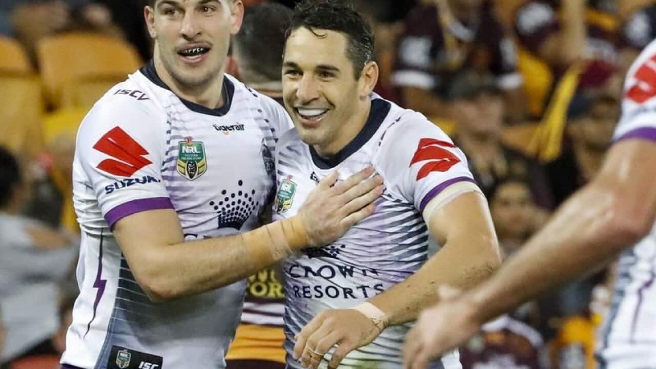 Billy Slater of the Storm celebrates with teammates.