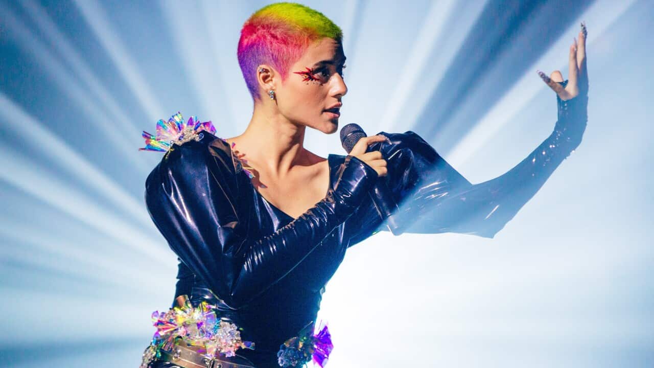 Montaigne singing on stage.