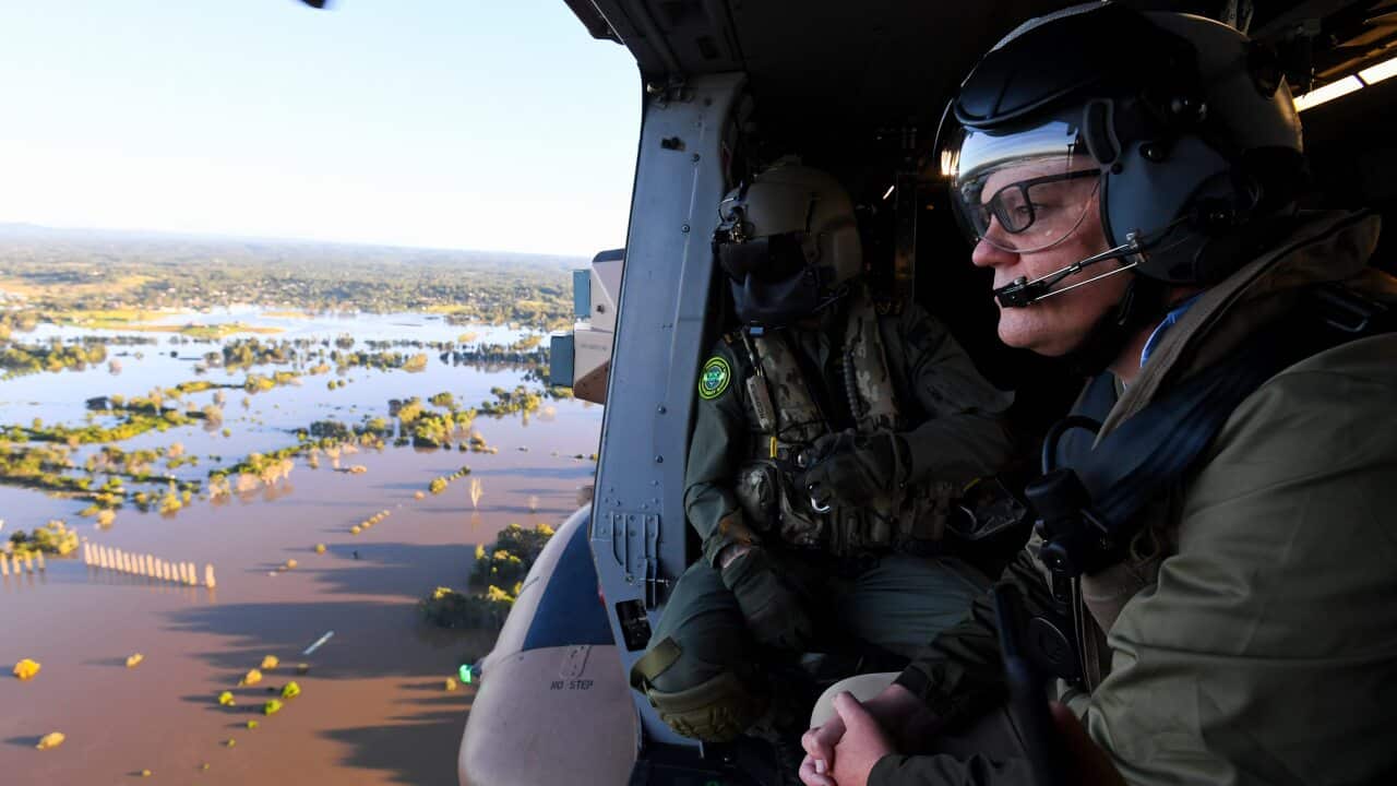 Prime Minister Scott Morrison inspects damage created by floodwaters from a helicopter in Sydney on Wednesday.