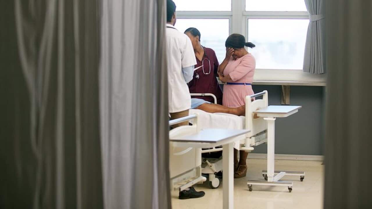 Doctor sharing bad news with family member