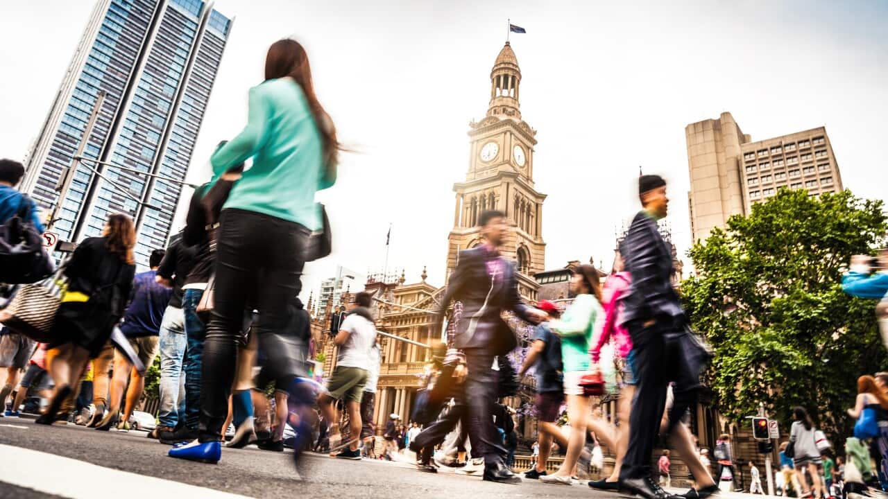 Sydney downtown, blurred intersection people and traffic