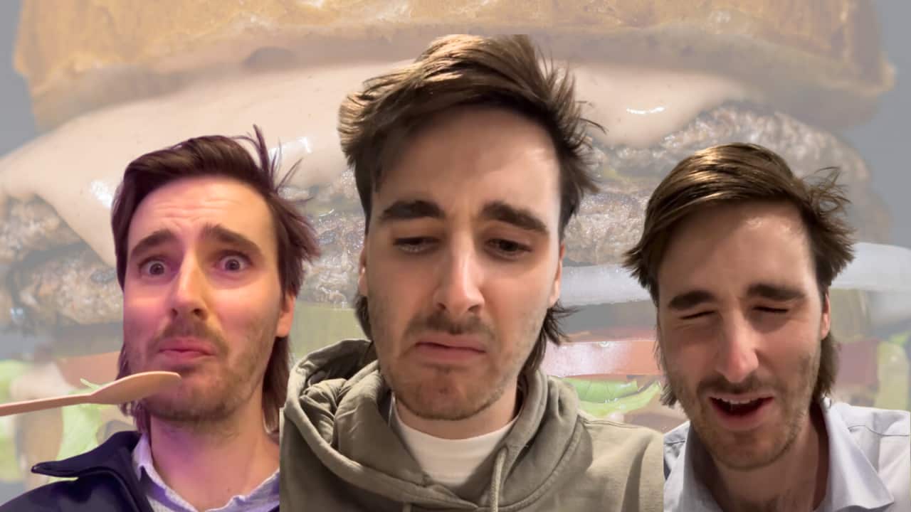 A man's face repeated three times, with different expressions of disgust and a shock. The background is a giant burger
