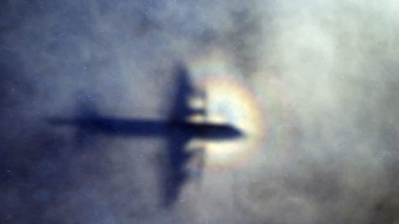 The shadow of a Royal New Zealand Air Force P3 Orion