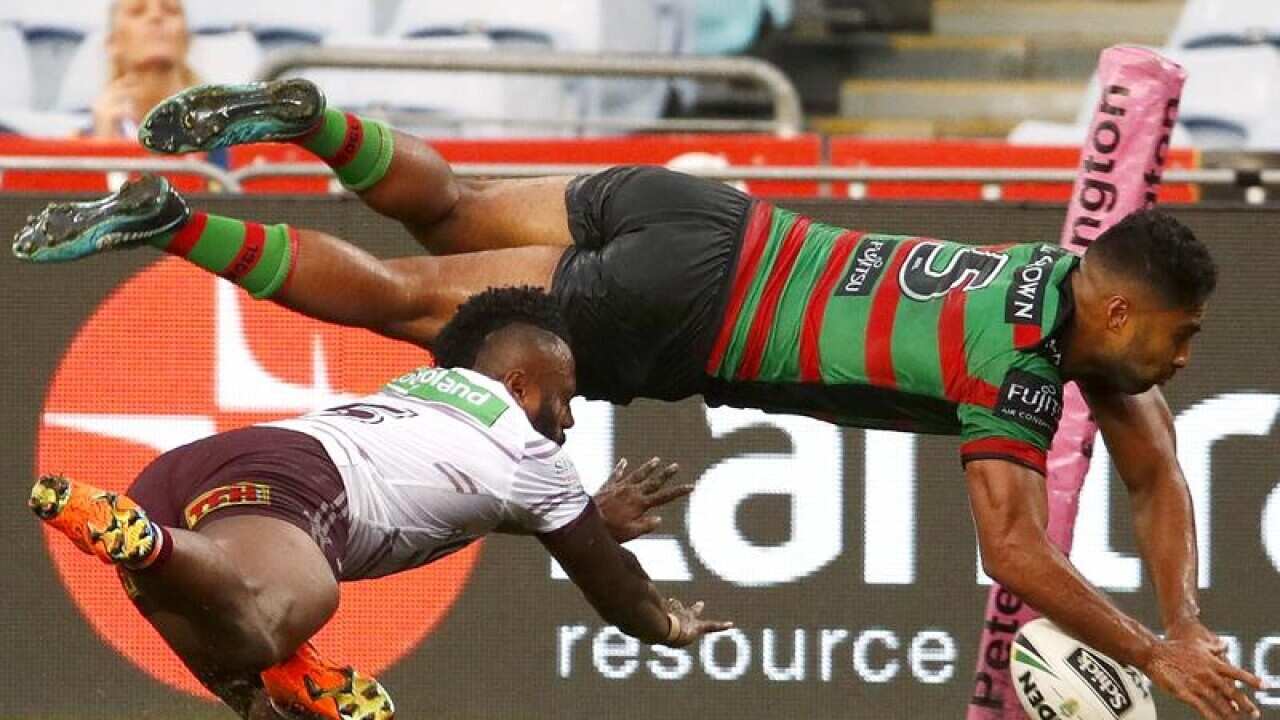 Robert Jennings of the Rabbitohs scores a try.
