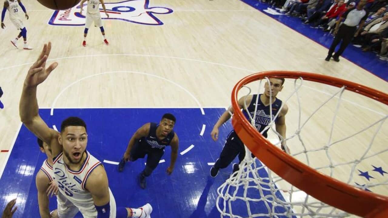 Philadelphia 76ers' Ben Simmons shoots against the Dallas Mavericks.